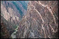 Sheer cliff with flourishes of crystalline pegmatite. Black Canyon of the Gunnison National Park, Colorado, USA. (color)