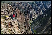Park visitor looking, Pulpit rock overlook. Black Canyon of the Gunnison National Park, Colorado, USA. (color)