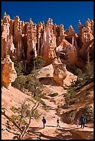 Hiker at the base of hoodoos. Bryce Canyon National Park, Utah, USA.