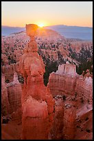 Sun rising behind Thor Hammer. Bryce Canyon National Park, Utah, USA. (color)