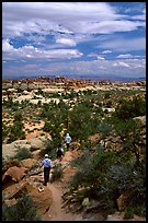 Hikers on the Chesler Park trail, the Needles. Canyonlands National Park, Utah, USA. (color)
