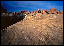 Sandstone swirls and Needles near Elephant Hill at sunrise, the Needles. Canyonlands National Park ( color)