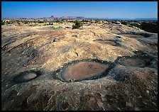 Empty pot holes on sandstone, Needles District. Canyonlands National Park, Utah, USA.