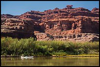 Canoeists and cliffs, Colorado River. Canyonlands National Park, Utah, USA.