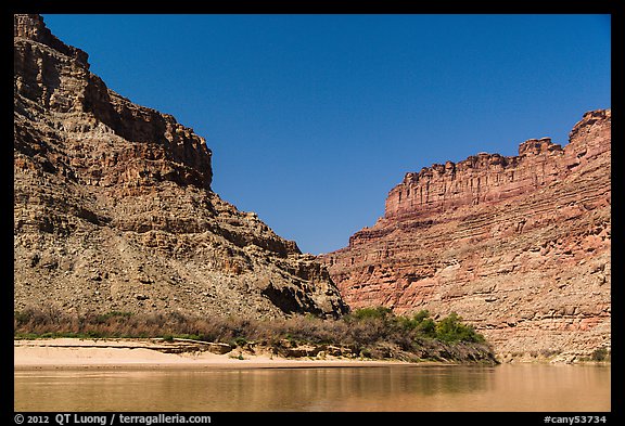 Cliffs towering above Confluence of Green and Colorado Rivers. Canyonlands National Park, Utah, USA.