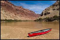 Red Canoe on beach near Confluence. Canyonlands National Park, Utah, USA. (color)