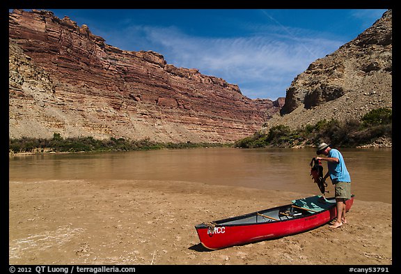 Canoeist and canoe near Confluence. Canyonlands National Park, Utah, USA.