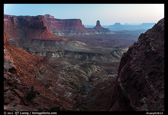 Cliffs and Candlestick Butte at dusk. Canyonlands National Park, Utah, USA.