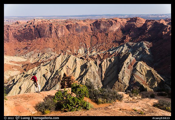 Person looking, Upheaval Dome. Canyonlands National Park, Utah, USA.