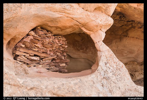 Granary nested in arch, Aztec Butte. Canyonlands National Park, Utah, USA.