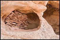 Granary nested in arch, Aztec Butte. Canyonlands National Park, Utah, USA.