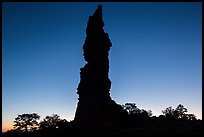 Standing Rock silhouette at sunrise. Canyonlands National Park, Utah, USA.