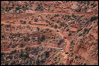 Jeep caravan negotiates hairpin turn on the Flint Trail,  Orange Cliffs Unit, Glen Canyon National Recreation Area, Utah. USA (color)