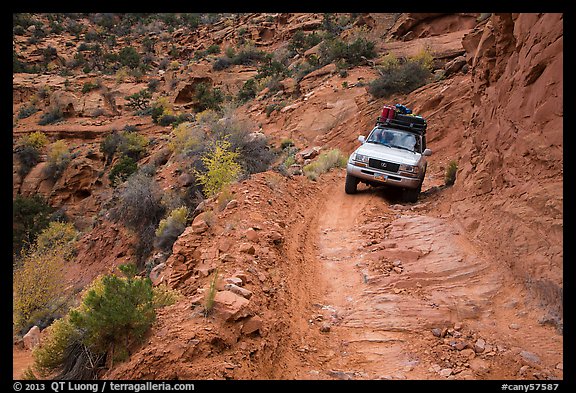 High clearance four-wheel-drive vehicle on the Flint Trail,  Orange Cliffs Unit,  Glen Canyon National Recreation Area, Utah. USA (color)