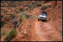 High clearance four-wheel-drive vehicle on the Flint Trail,  Orange Cliffs Unit,  Glen Canyon National Recreation Area, Utah. USA (color)