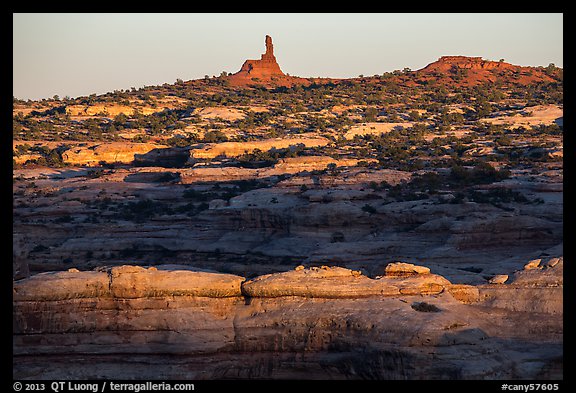 Maze and Chimney Rock at sunset, land of Standing rocks. Canyonlands National Park, Utah, USA.