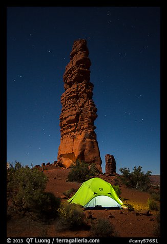 Tent at the base of Standing Rock at night. Canyonlands National Park, Utah, USA.