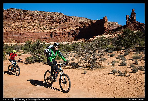 Mountain bikers in Teapot Canyon, Maze District. Canyonlands National Park, Utah, USA.