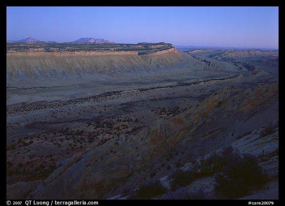 Blue light on Waterpocket Fold cliffs at dusk from Strike Valley Overlook. Capitol Reef National Park, Utah, USA.