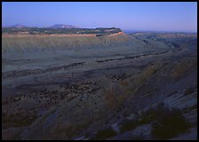 Blue light on Waterpocket Fold cliffs at dusk from Strike Valley Overlook. Capitol Reef National Park, Utah, USA. (color)