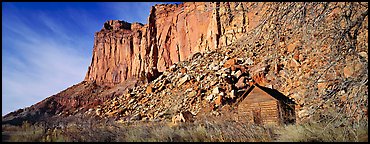 Fruita pioneer school house at the base of sandstone cliffs. Capitol Reef National Park, Utah, USA.