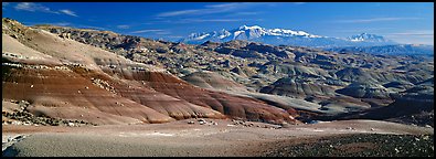 Mudstone landscape and snowy mountains, Cathedral Valley. Capitol Reef National Park (Panoramic color)