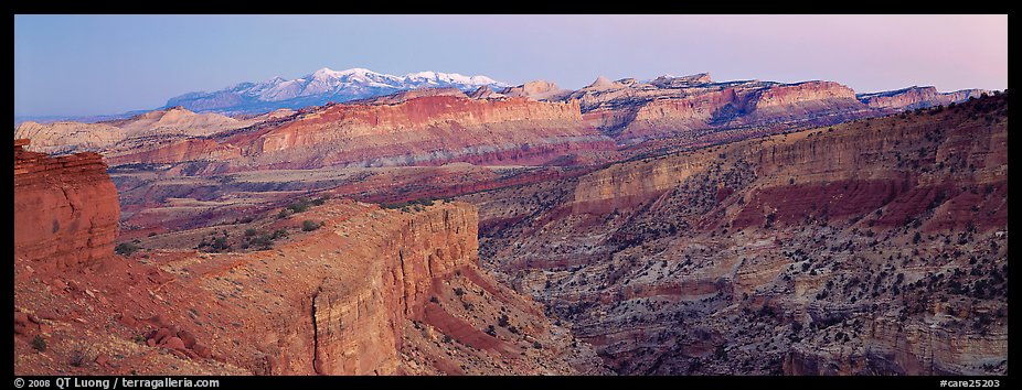 Panorama of multi-hued cliffs and Henry Mountains at dusk. Capitol Reef National Park (color)