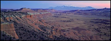 Desert view with cliffs and mountains at dusk. Capitol Reef National Park (Panoramic color)