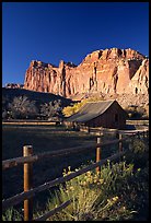 Fence, Old barn, horse and cliffs, Fruita. Capitol Reef National Park, Utah, USA.