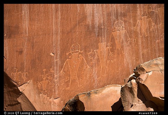 Fremont petroglyphs of human figures in red sandstone. Capitol Reef National Park (color)