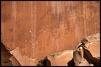 Fremont petroglyphs of human figures in red sandstone. Capitol Reef National Park ( color)