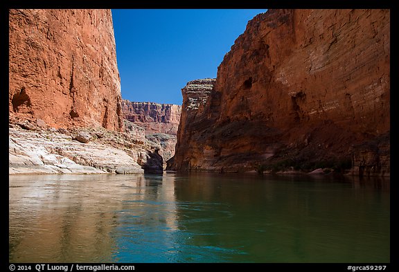 River-level view of redwall limestone canyon walls dropping straight into Colorado River. Grand Canyon National Park, Arizona, USA.