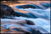 Boulders and rapids with color from canyon walls reflected. Grand Canyon National Park ( color)