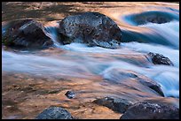 Boulders and rapids with glow from canyon walls reflected. Grand Canyon National Park ( color)