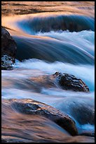 Boulders and rapids with warm light from canyon walls reflected. Grand Canyon National Park ( color)