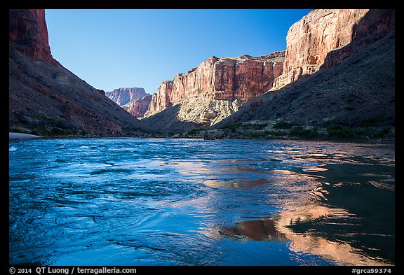 Cliffs reflected in Colorado River rapids, morning. Grand Canyon National Park, Arizona, USA.