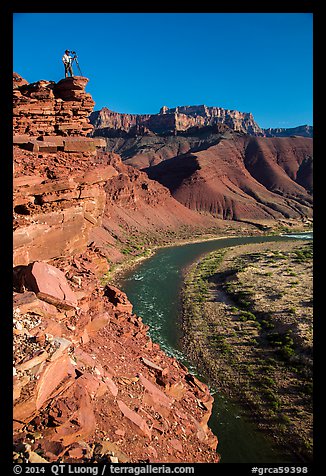 Photographer on sheer cliff above Unkar rapids. Grand Canyon National Park (color)