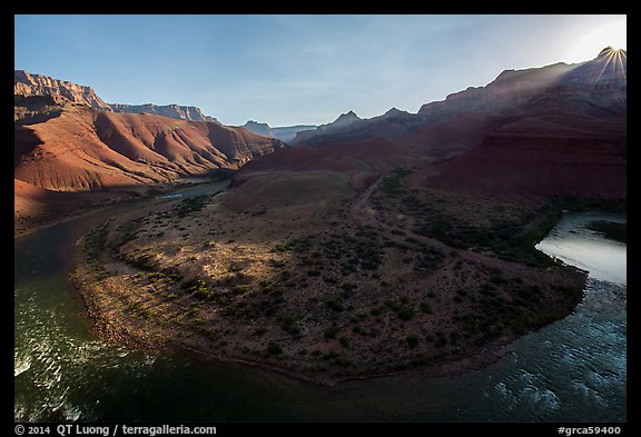 Sunburst on rim above Unkar rapids river bend. Grand Canyon National Park (color)