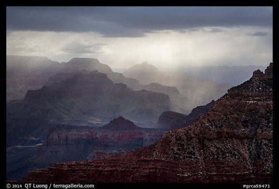 Canyon ridges with dramatic clouds and sunrays. Grand Canyon National Park (color)