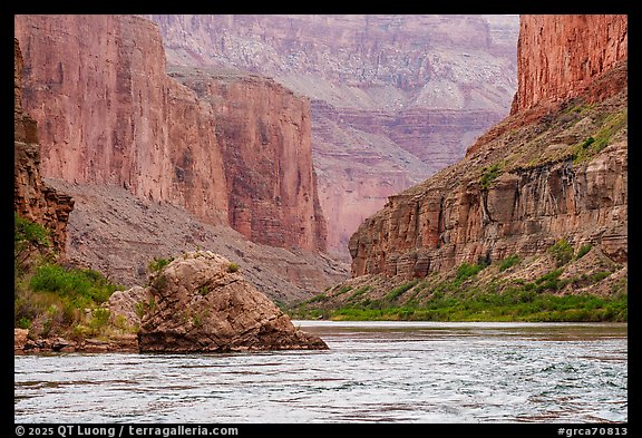 The Colorado River winds past imposing red vertical walls. Grand Canyon National Park (color)