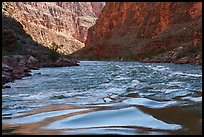 The Colorado surges through narrow walls with cliffs tinted by manganese and iron. Grand Canyon National Park ( color)