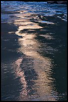 Glowing reflections streak the river's surface in ribbons of light. Grand Canyon National Park ( color)