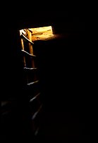 Dark kiva room with Ladder through light opening, Spruce Tree house. Mesa Verde National Park, Colorado, USA. (color)