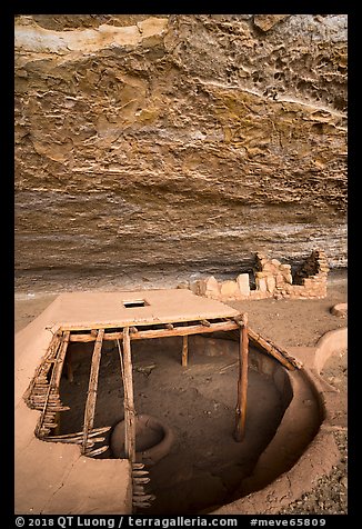 Reconstructed pithouse and original walls below rock roof, Step House. Mesa Verde National Park (color)