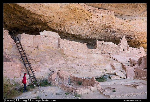 Visitor looking, Long House. Mesa Verde National Park (color)