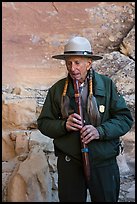 Native American Ranger plays flute to honor ancestors. Mesa Verde National Park ( color)