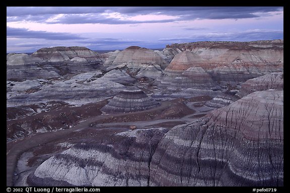 Multi-hued badlands of Blue Mesa, sunset. Petrified Forest National Park, Arizona, USA.