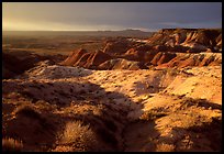 Badlands of  Chinle Formation seen from Whipple Point, stormy sunset. Petrified Forest National Park, Arizona, USA.