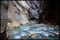 Virgin River flows over boulders under soaring walls of the Narrows. Zion National Park ( color)