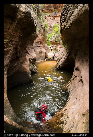 Canyoneers swim through a pothole, Upper Left Fork. Zion National Park, Utah (color)